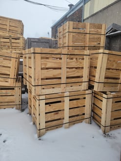 Crates stacked up outdoors on snow