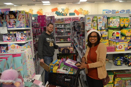 team members shop for the community at annual Shop Til You Drop event