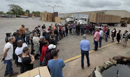 the Pasadena Skid & Pallet team gathered in a semi-circle